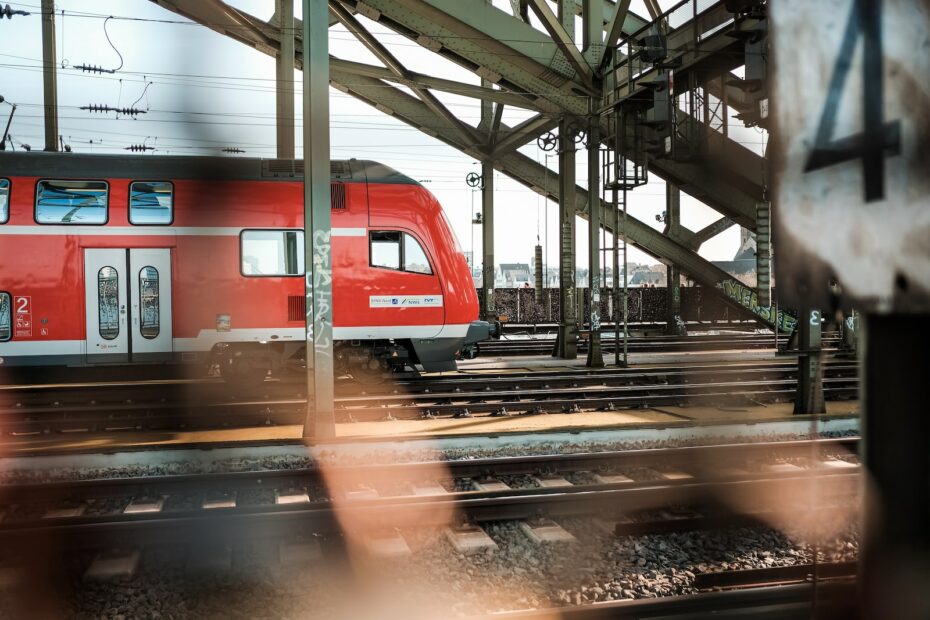 red and white train on train station